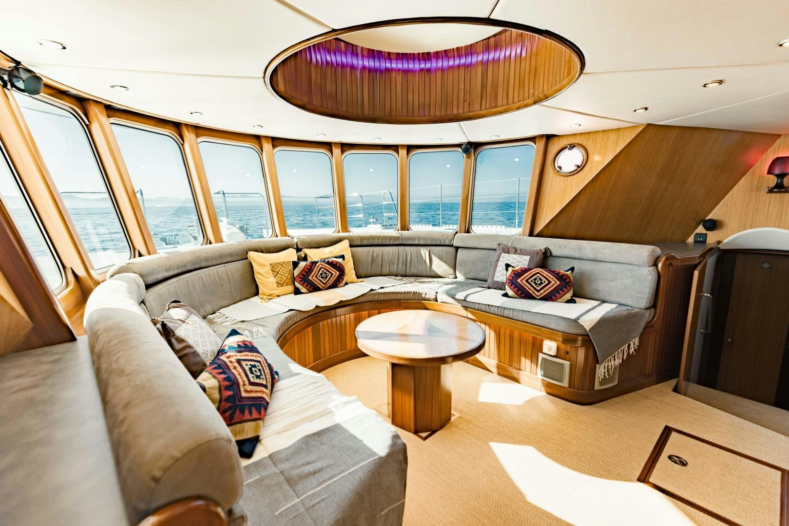 a living room with a large window aboard IETA Yacht for Sale