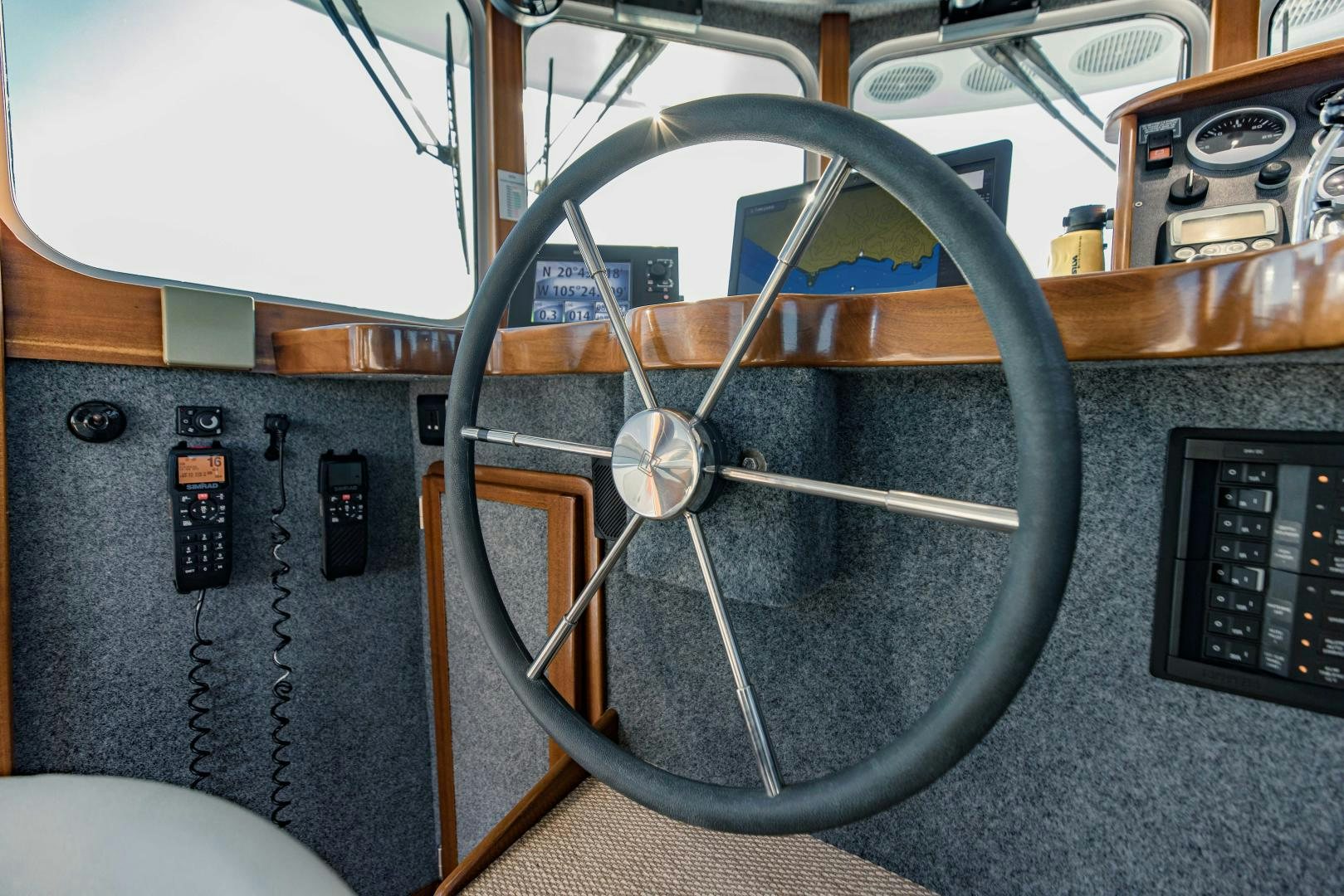a close-up of a steering wheel aboard IETA Yacht for Sale