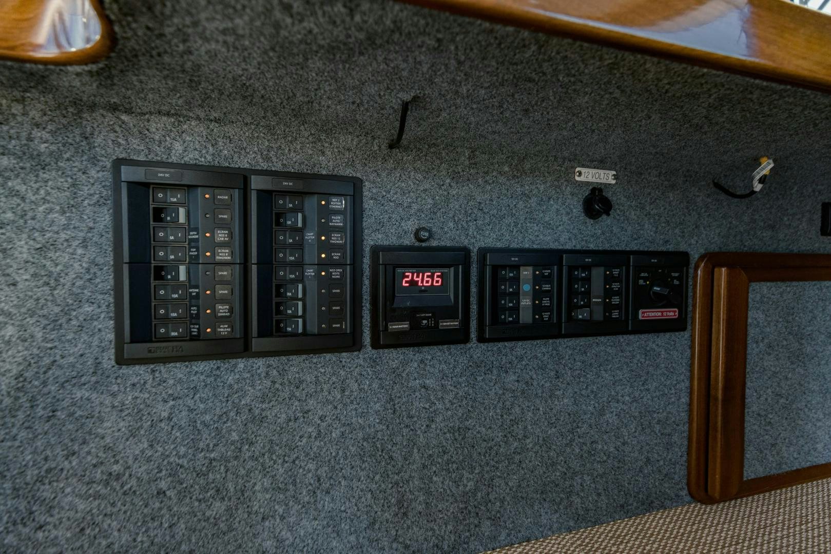 a black rectangular device with a red and white display aboard IETA Yacht for Sale