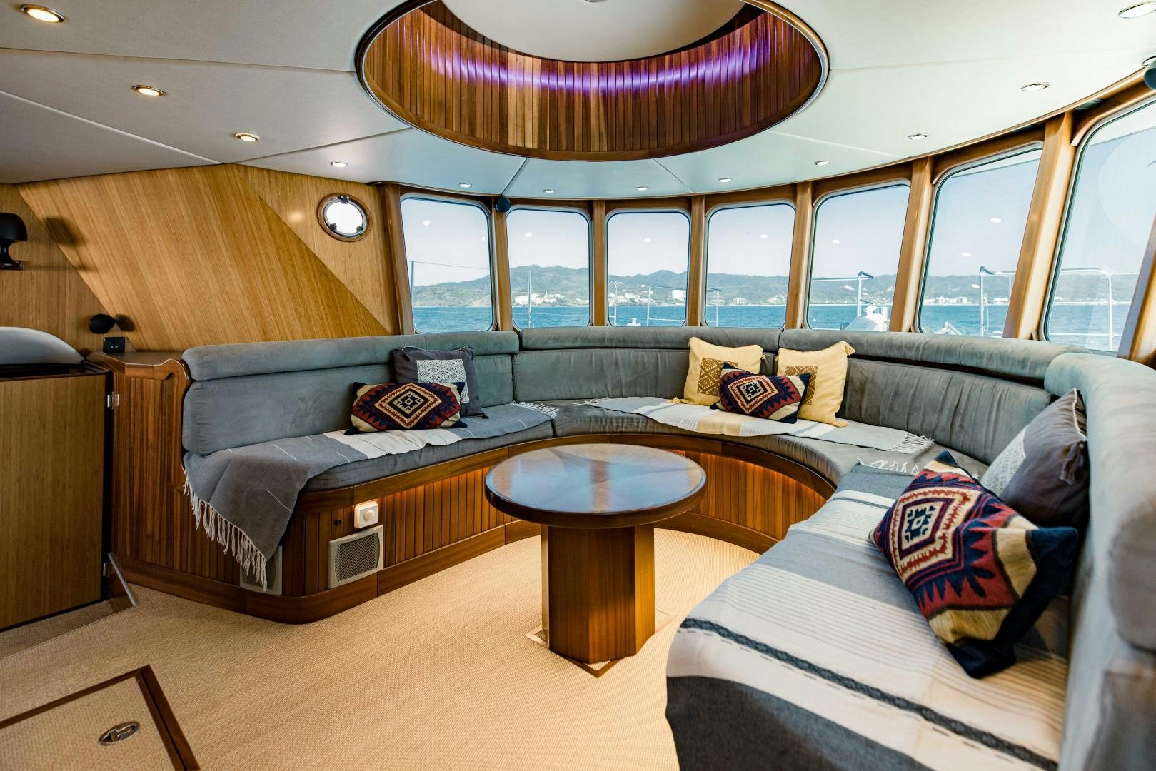 a living room with a couch and a table aboard IETA Yacht for Sale