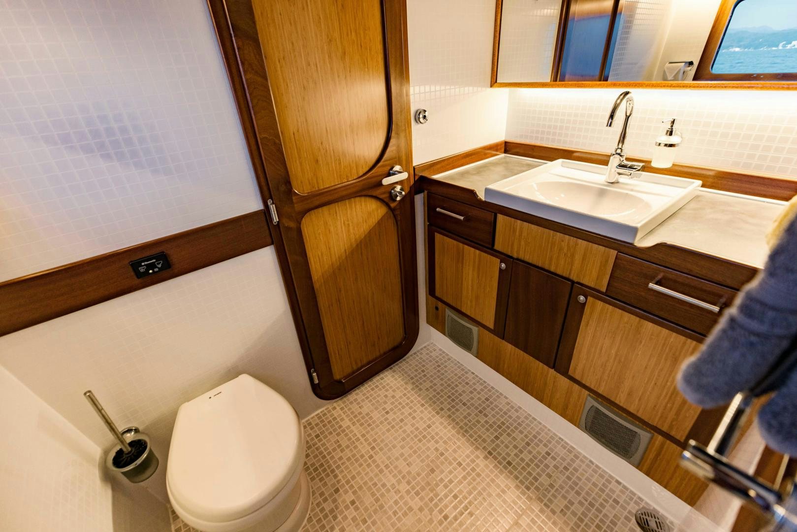 a bathroom with a toilet and sink aboard IETA Yacht for Sale