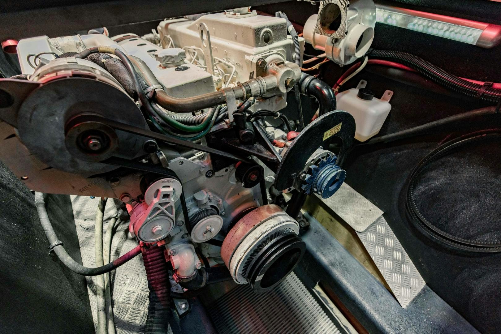 a car engine with a car hood aboard IETA Yacht for Sale