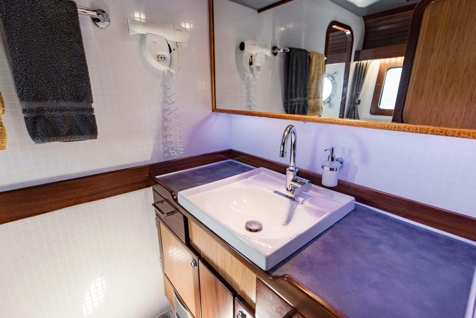 a bathroom with a countertop sink aboard IETA Yacht for Sale