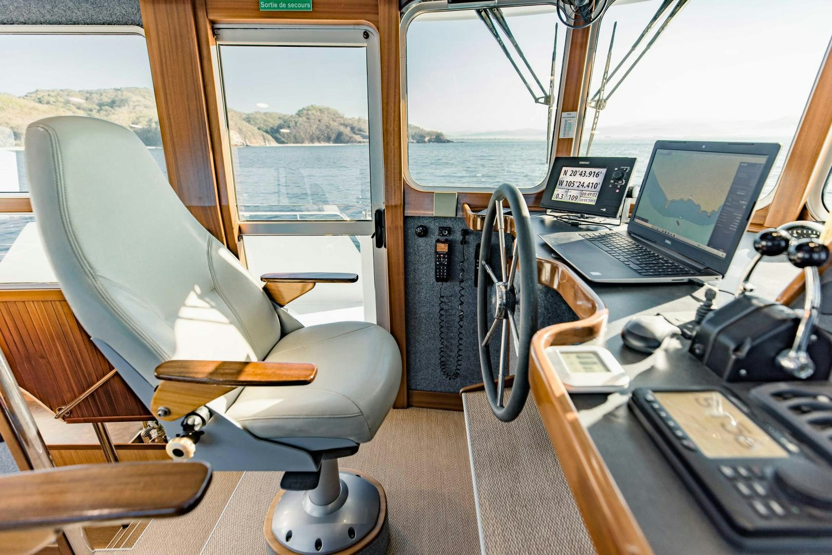 a room with a laptop and headphones aboard IETA Yacht for Sale