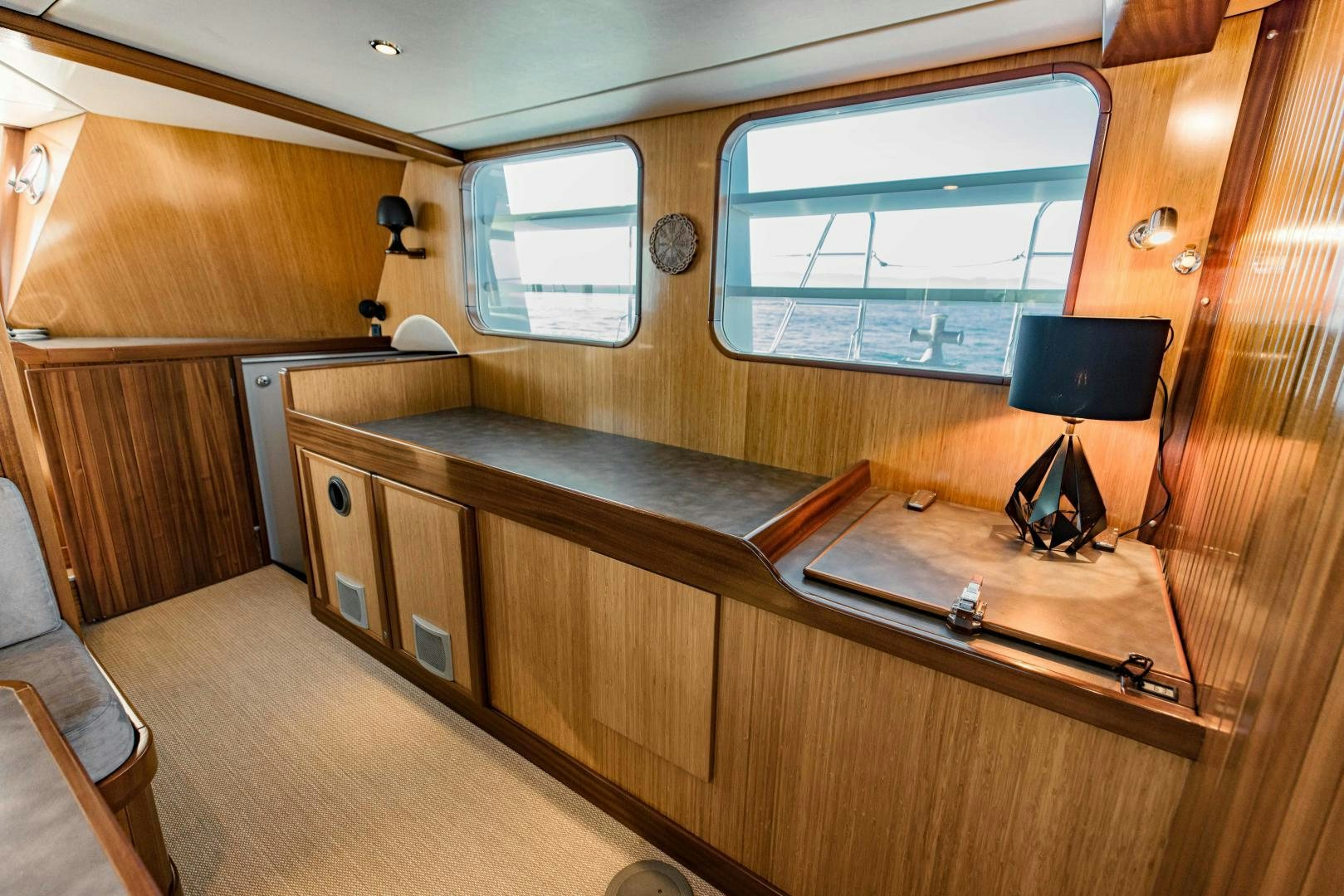 a room with a desk and a window aboard IETA Yacht for Sale