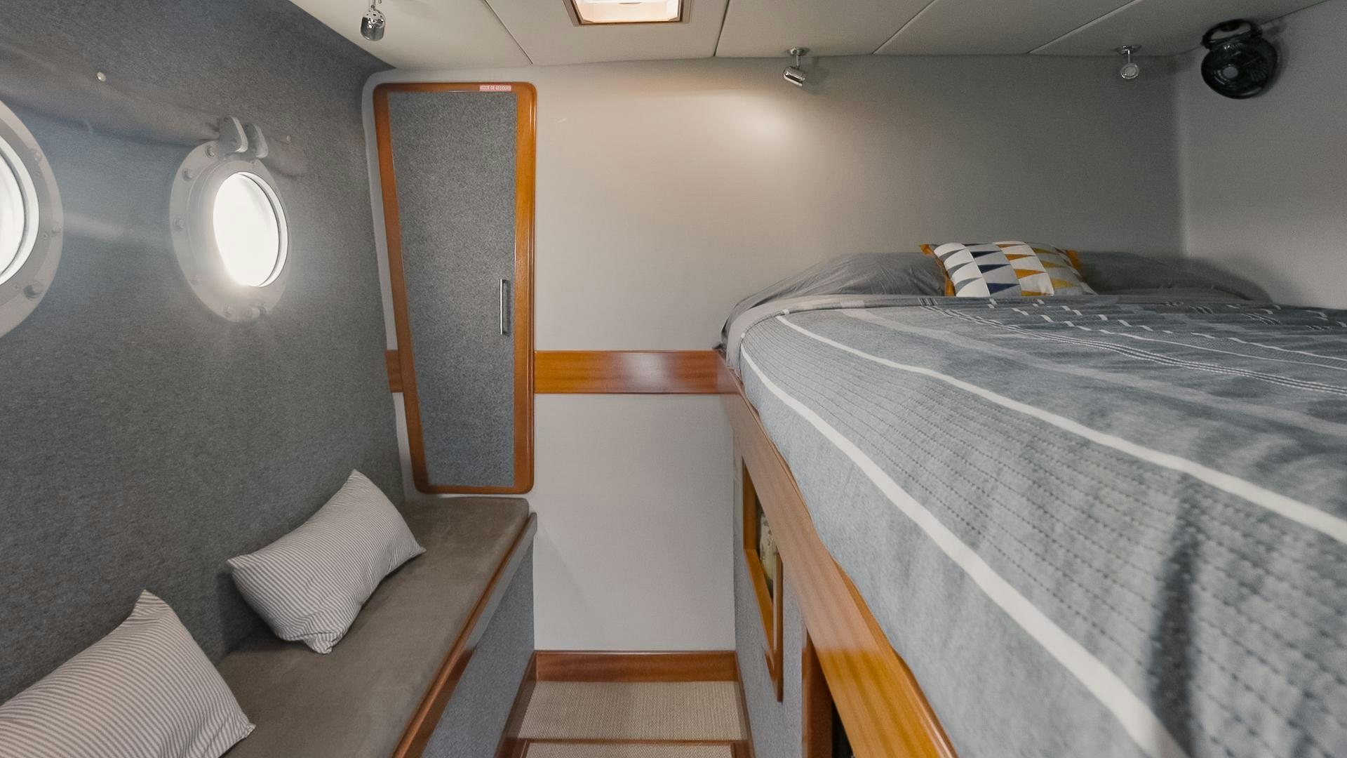 a small room with two beds aboard IETA Yacht for Sale