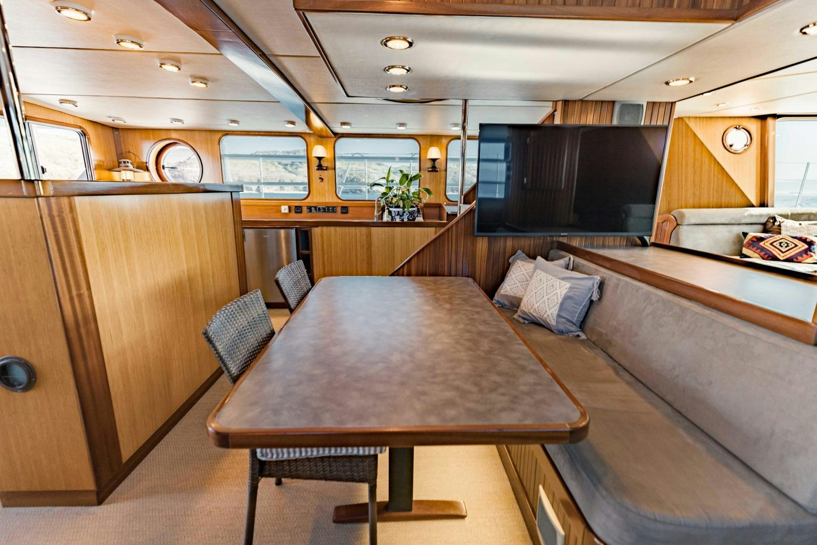 a large kitchen with a bar and bar aboard IETA Yacht for Sale