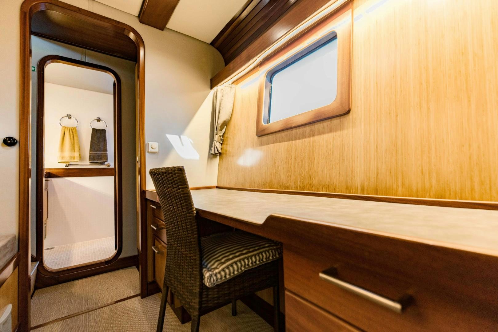 a chair next to a mirror aboard IETA Yacht for Sale