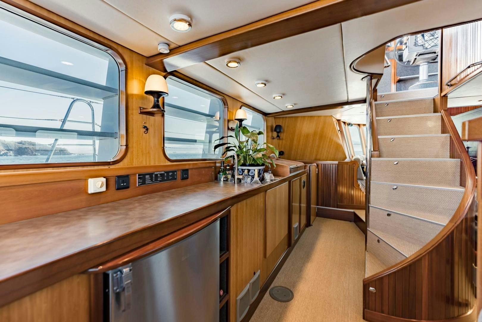 a room with wooden cabinets aboard IETA Yacht for Sale