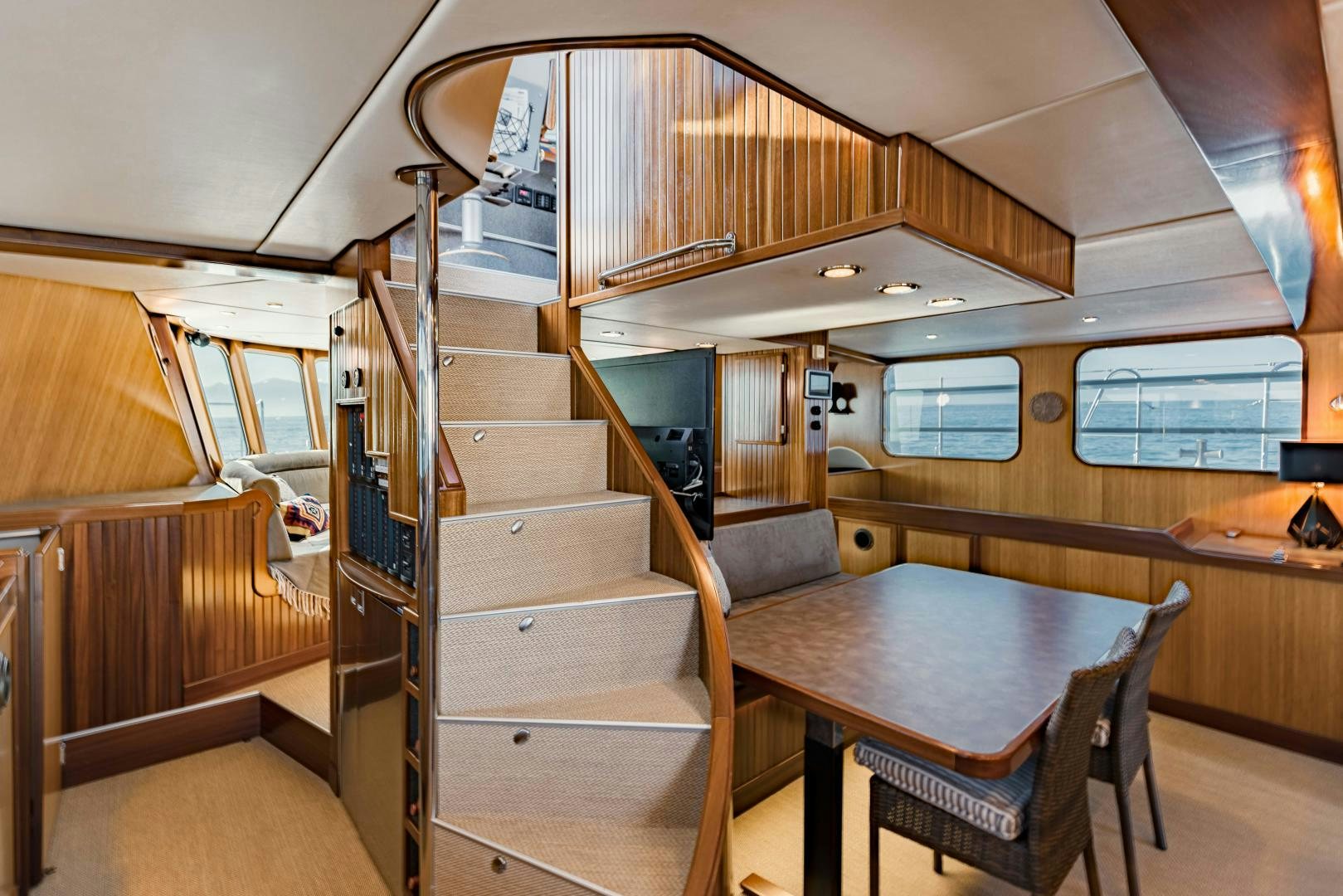 a room with wooden stairs aboard IETA Yacht for Sale