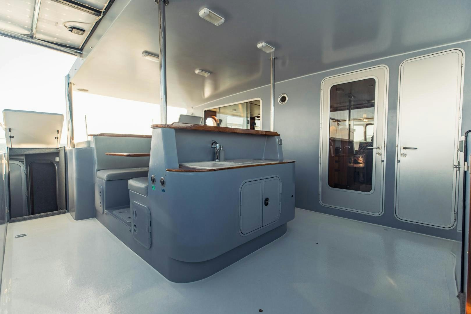 a kitchen with a sink and cabinets aboard IETA Yacht for Sale