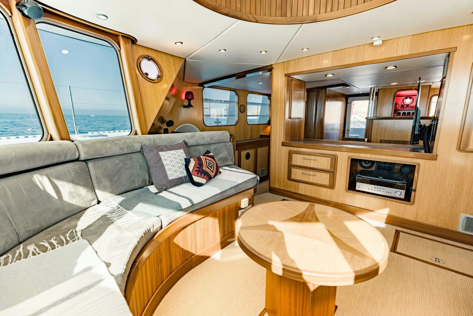 a living room with a couch and a table aboard IETA Yacht for Sale