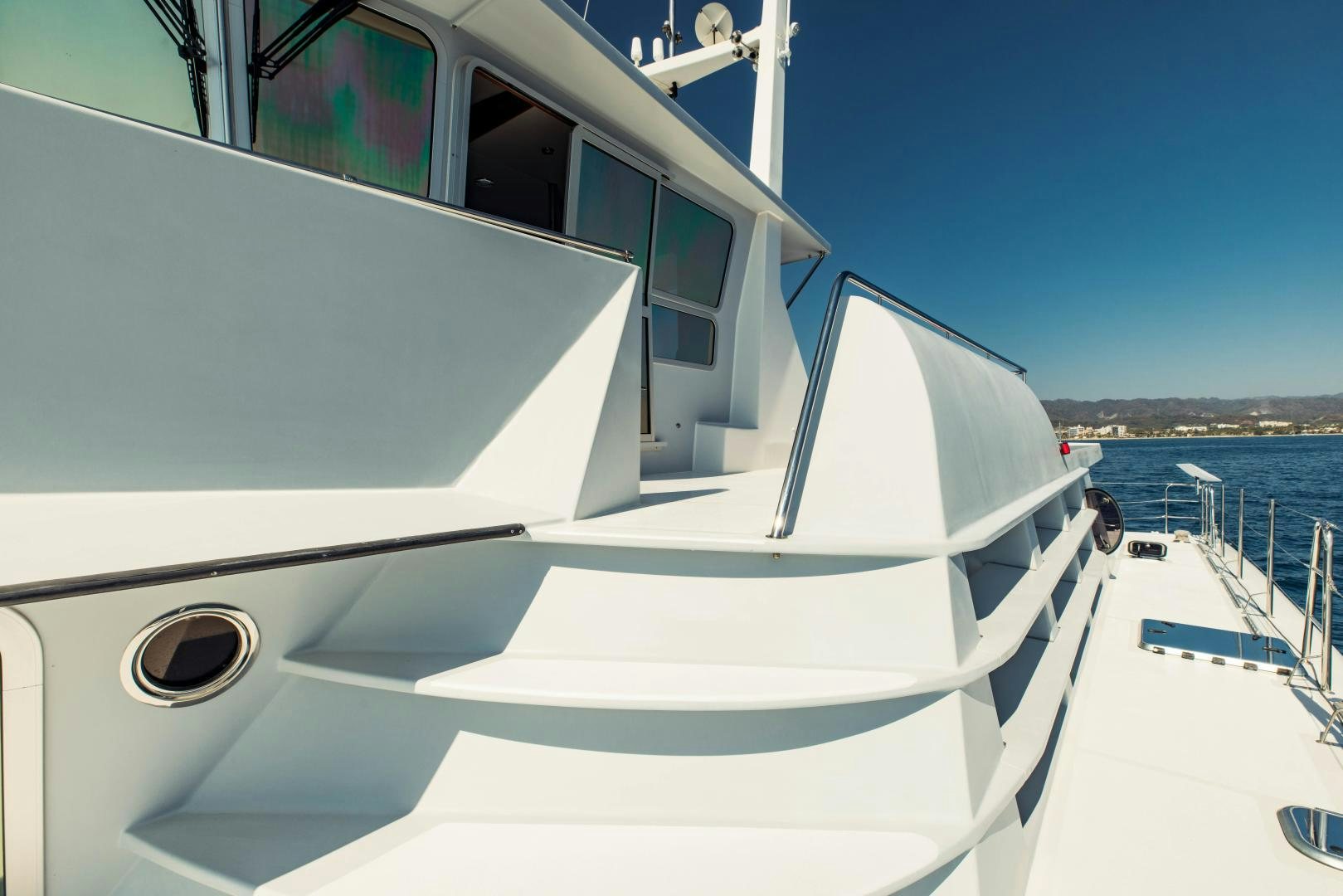 a white boat on a body of water aboard IETA Yacht for Sale