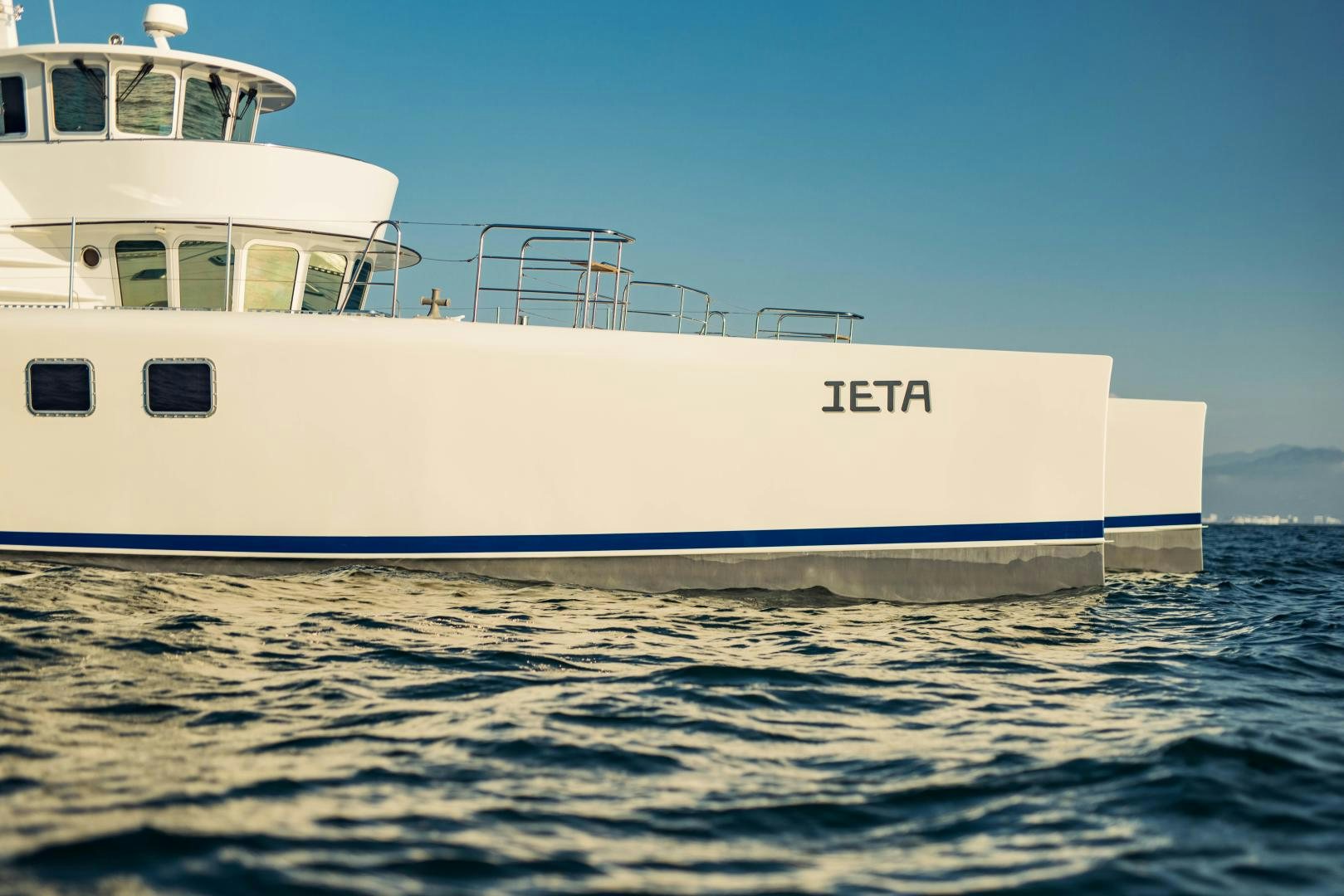 a large white boat in the water aboard IETA Yacht for Sale