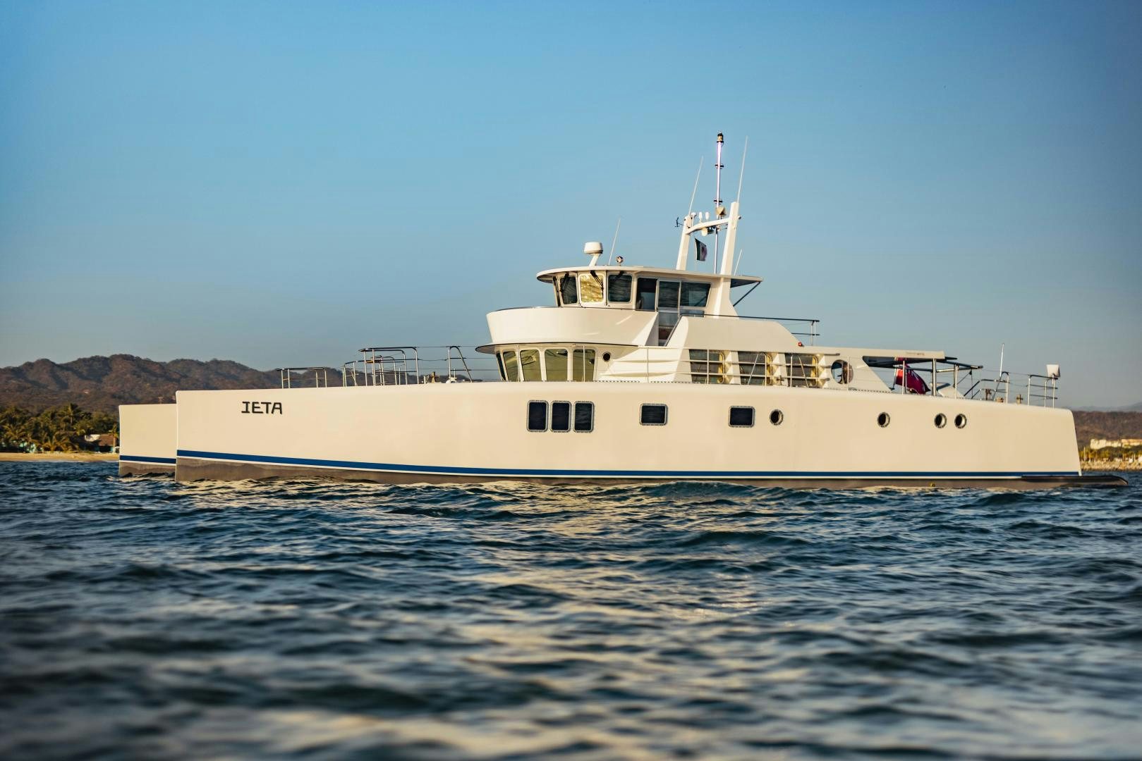 a large white boat in the water aboard IETA Yacht for Sale