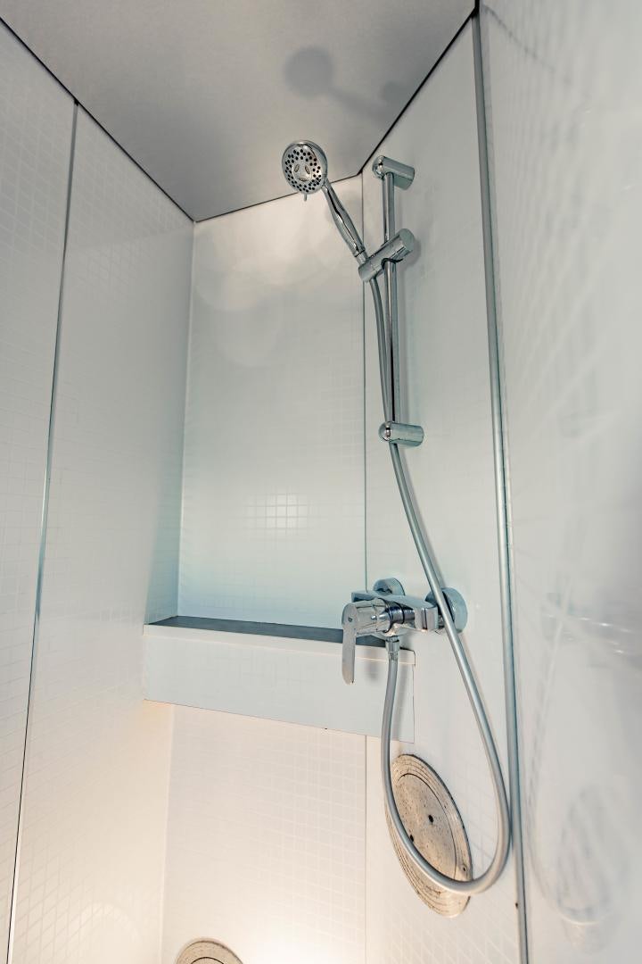 a shower head in a bathroom aboard IETA Yacht for Sale