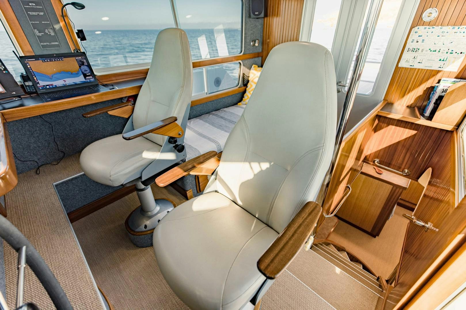 a room with a chair and a desk with a computer on it aboard IETA Yacht for Sale