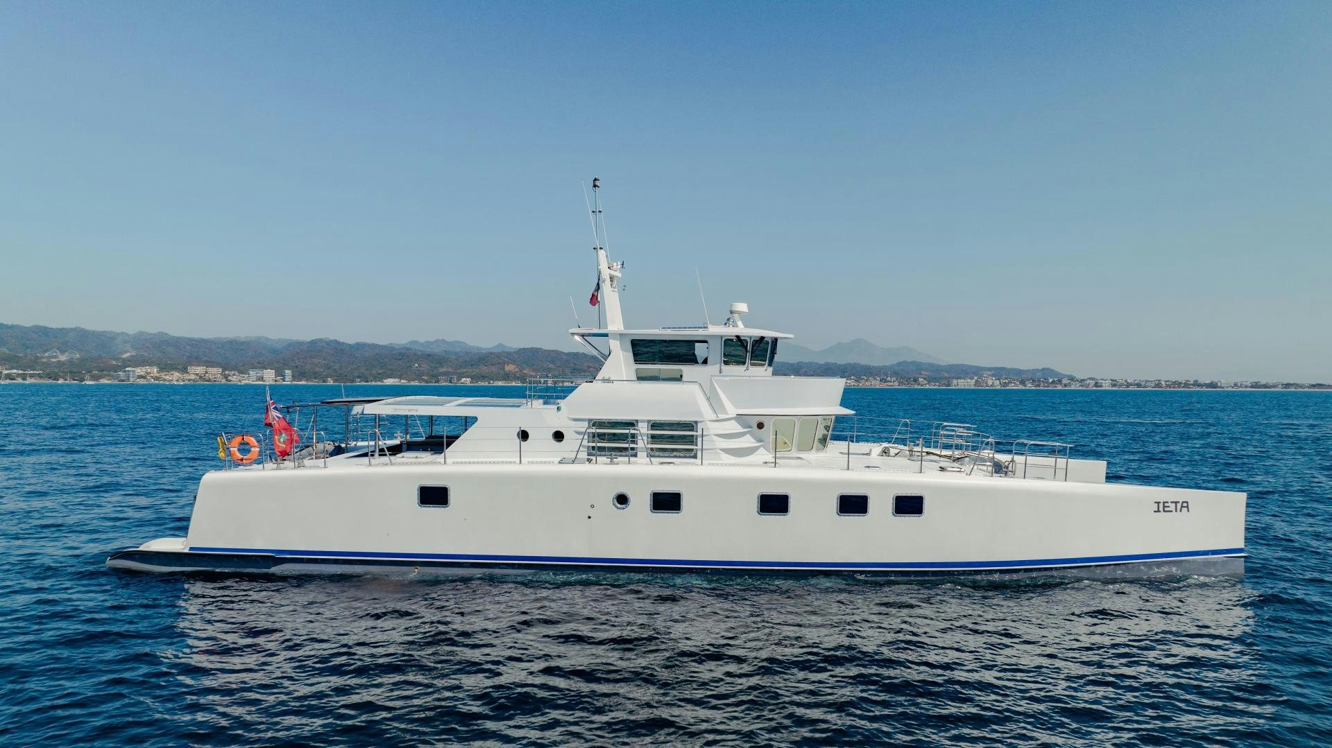 a white boat in the water aboard IETA Yacht for Sale