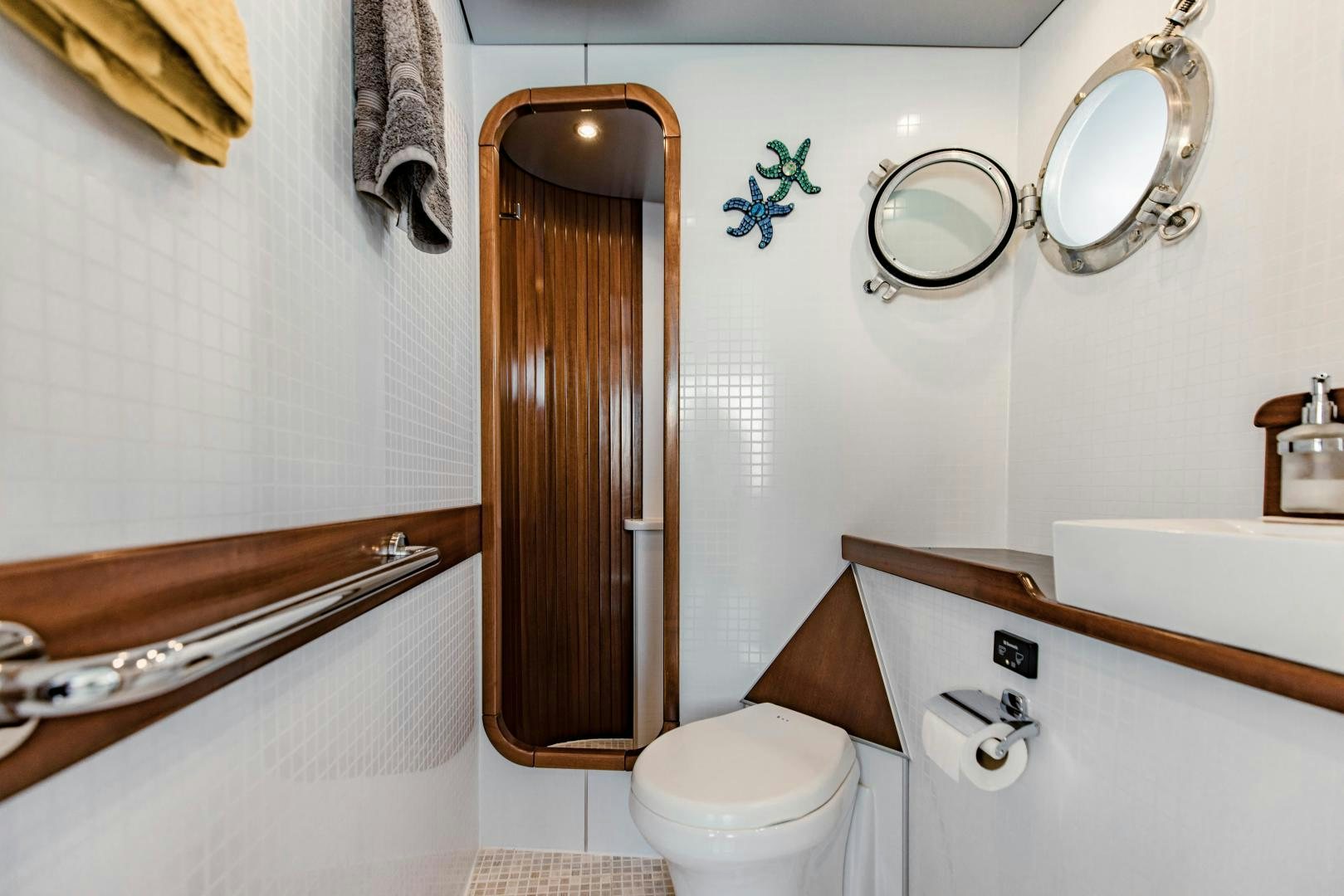 a bathroom with a toilet and sink aboard IETA Yacht for Sale