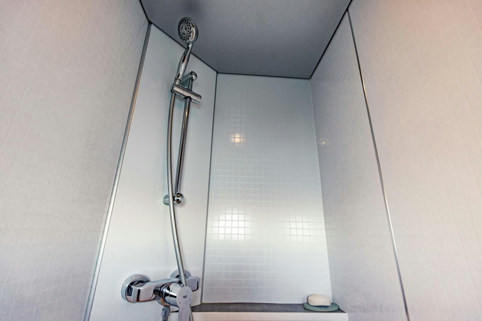 a shower with a glass door aboard IETA Yacht for Sale