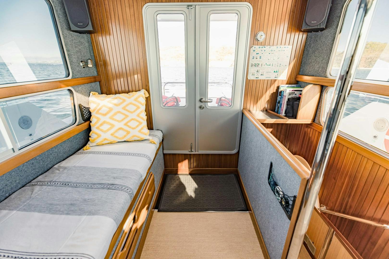 a train with a bed and a desk aboard IETA Yacht for Sale