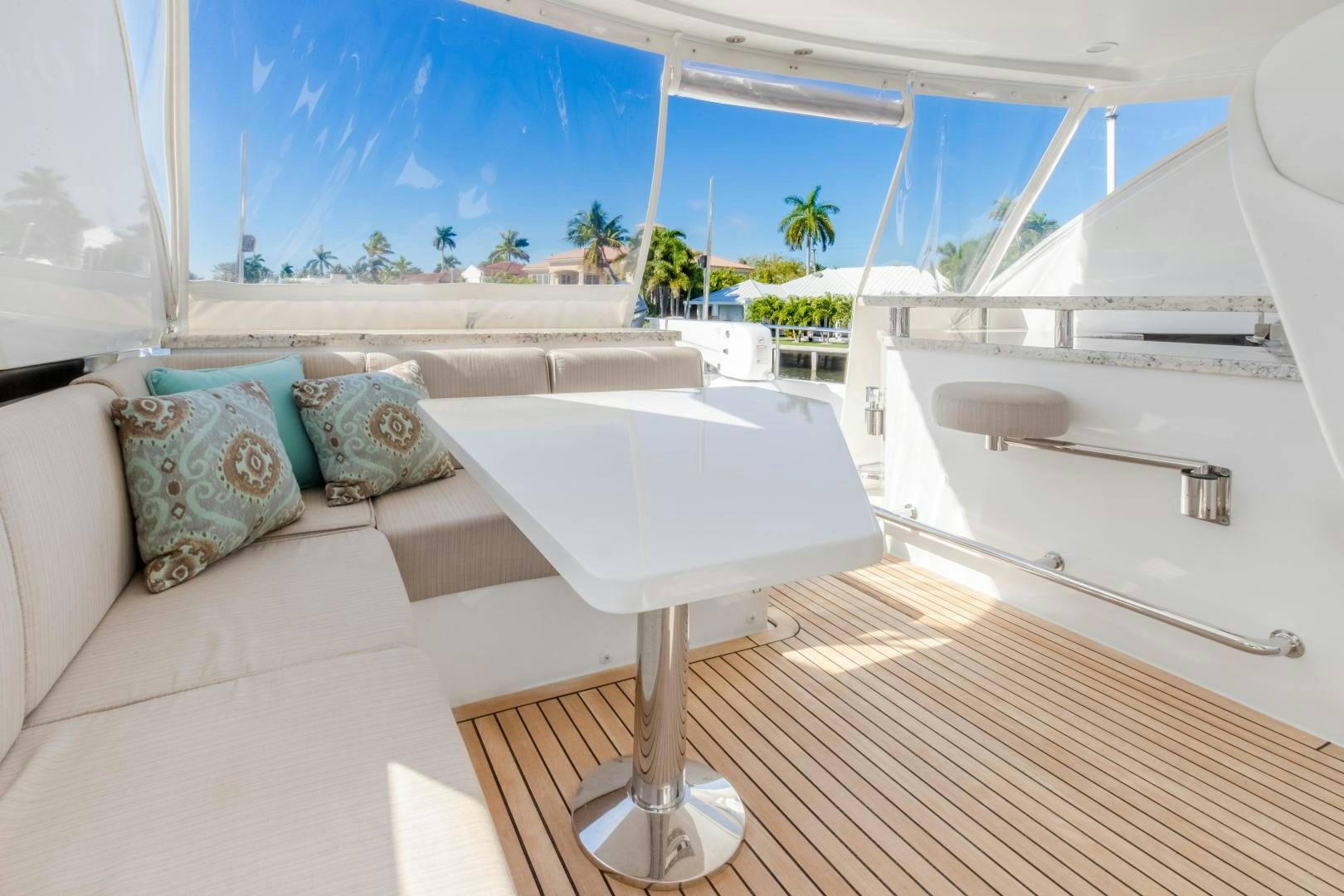 a room with a bed and a table aboard JOURNEY Yacht for Sale
