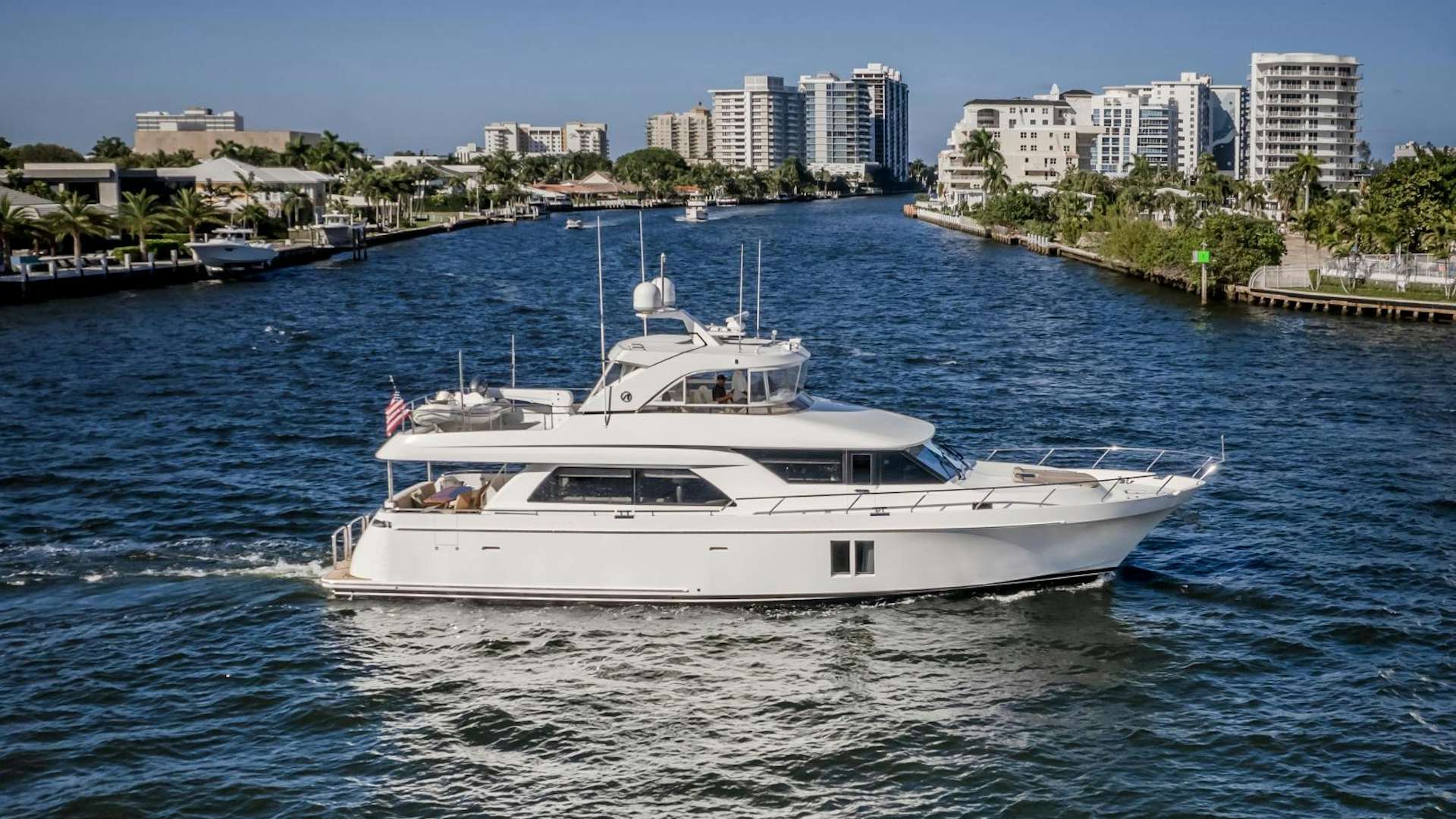 a white yacht in the water aboard Journey Yacht for Sale