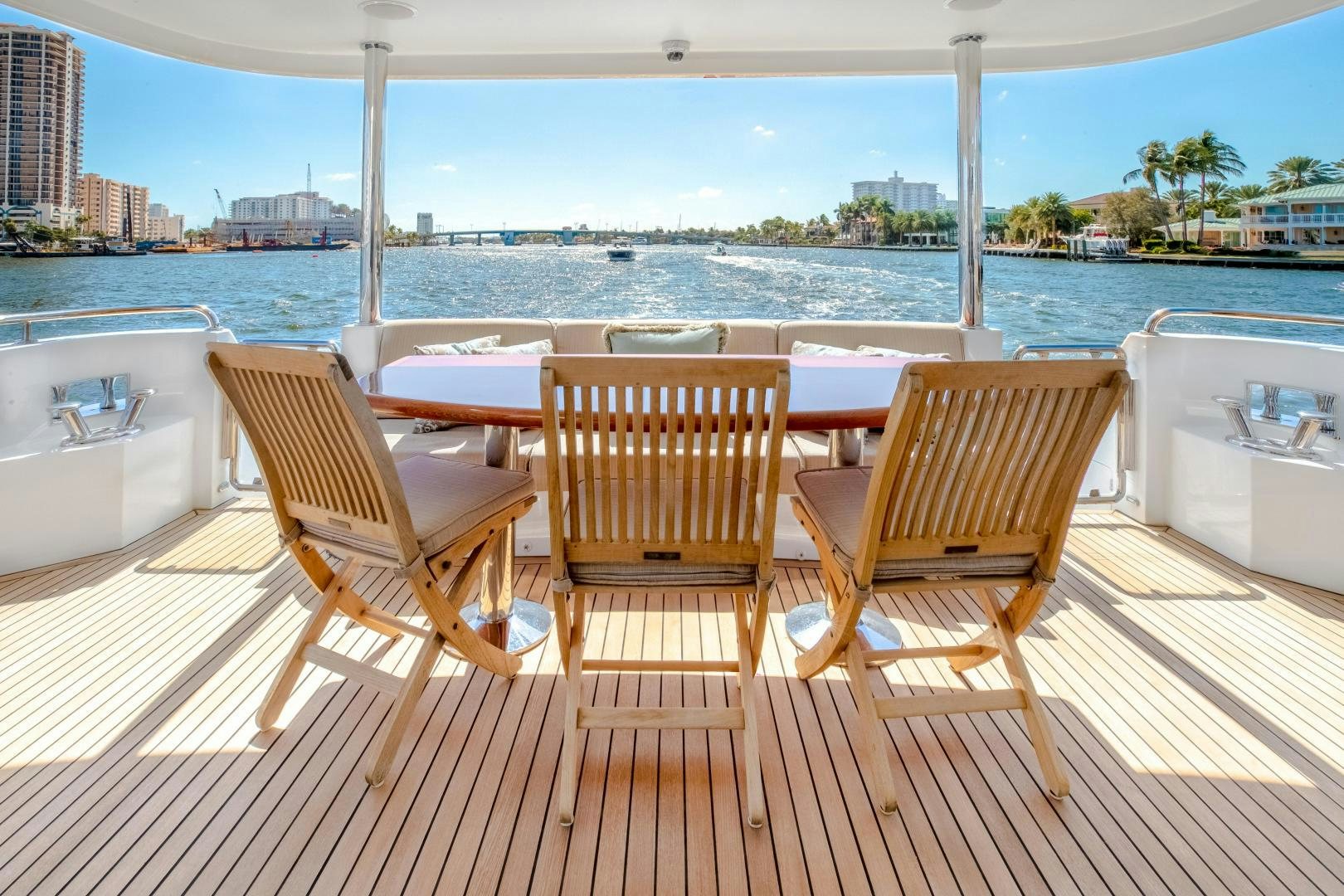 a group of chairs on a deck overlooking a body of water aboard JOURNEY Yacht for Sale