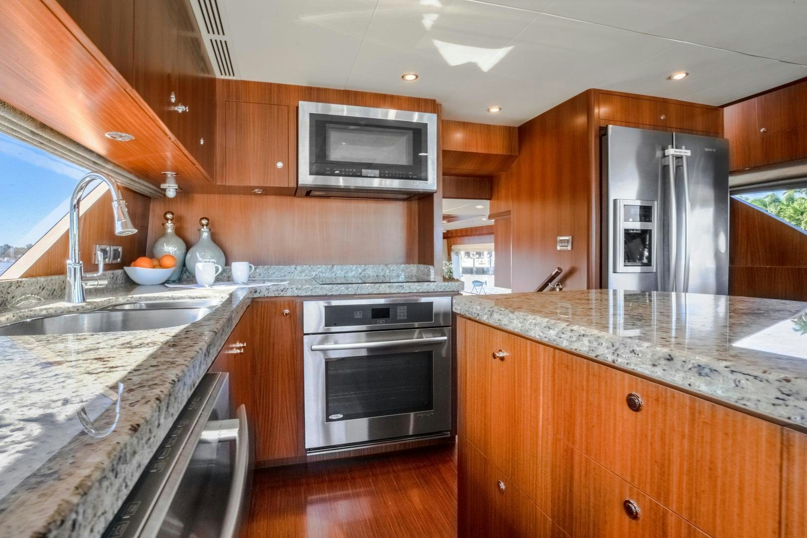 a kitchen with a stainless steel oven aboard JOURNEY Yacht for Sale