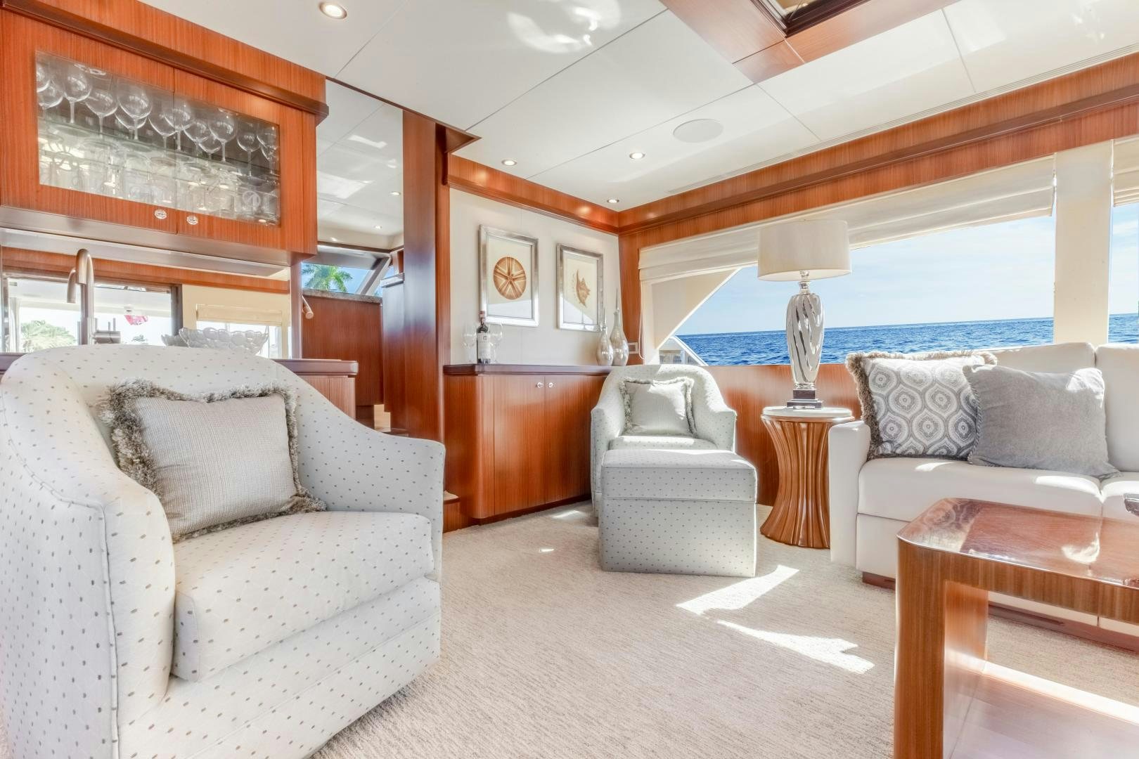 a living room with a large window aboard JOURNEY Yacht for Sale