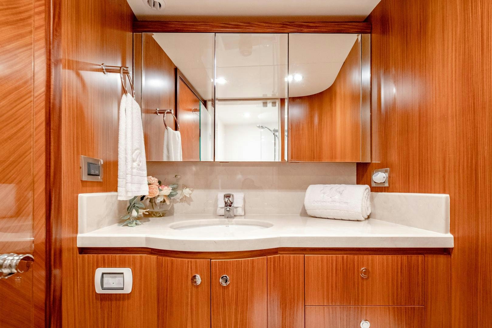 a bathroom with a sink and mirror aboard JOURNEY Yacht for Sale