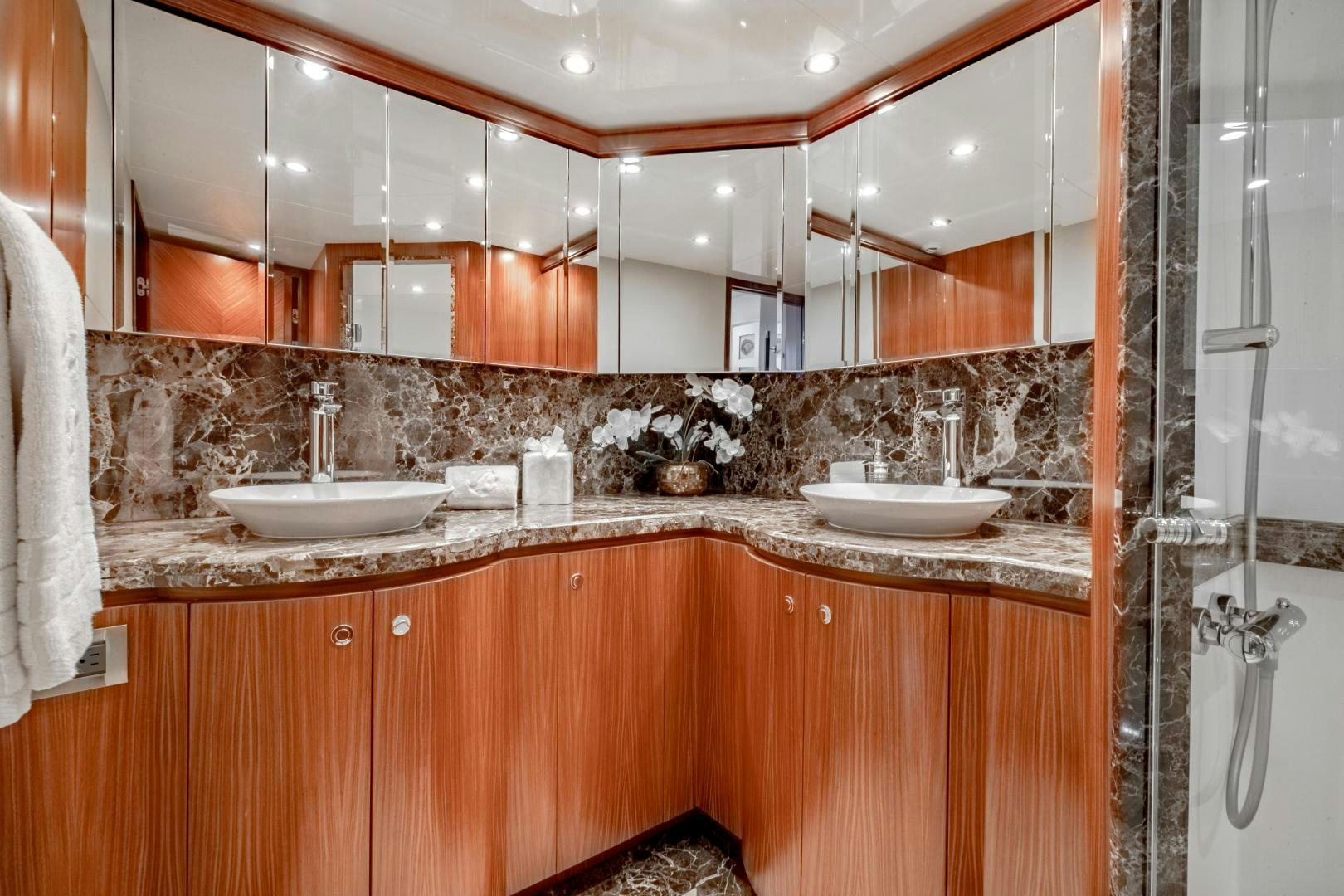 a bathroom with a sink and a mirror aboard JOURNEY Yacht for Sale