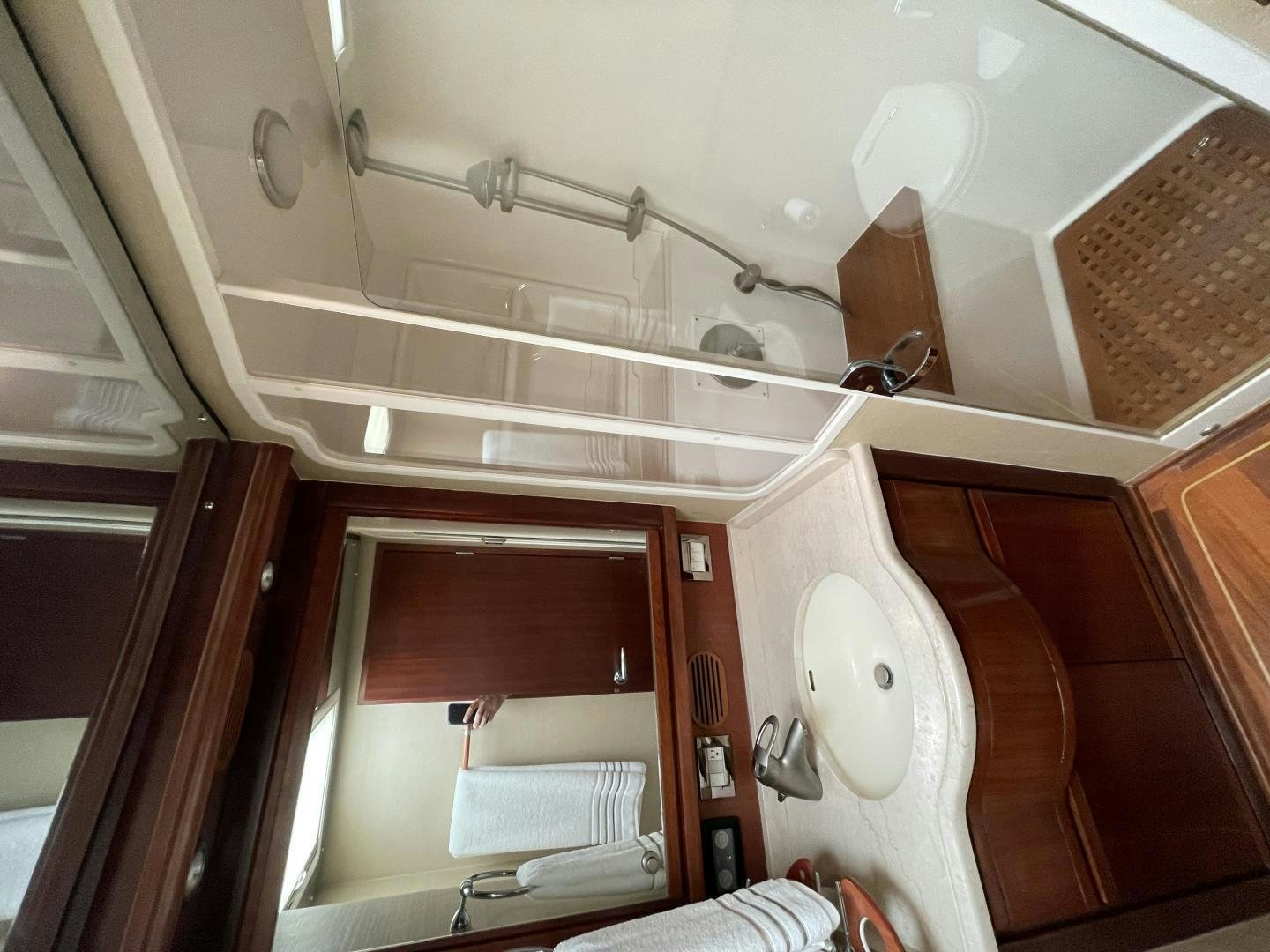 a white bathroom with a large window aboard ONIX Yacht for Sale