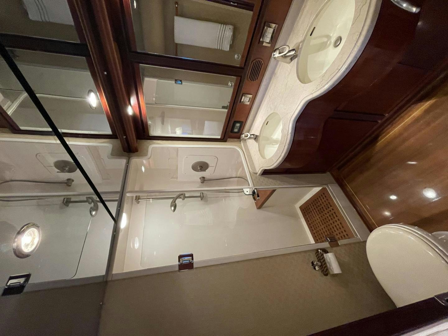 a bathroom with a large mirror aboard ONIX Yacht for Sale