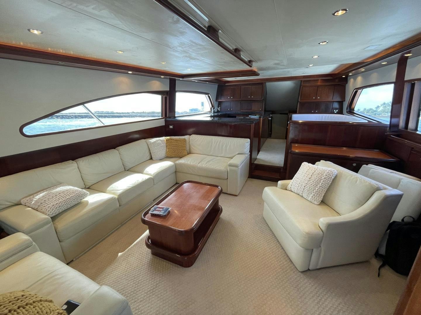 a room with couches and a window aboard ONIX Yacht for Sale