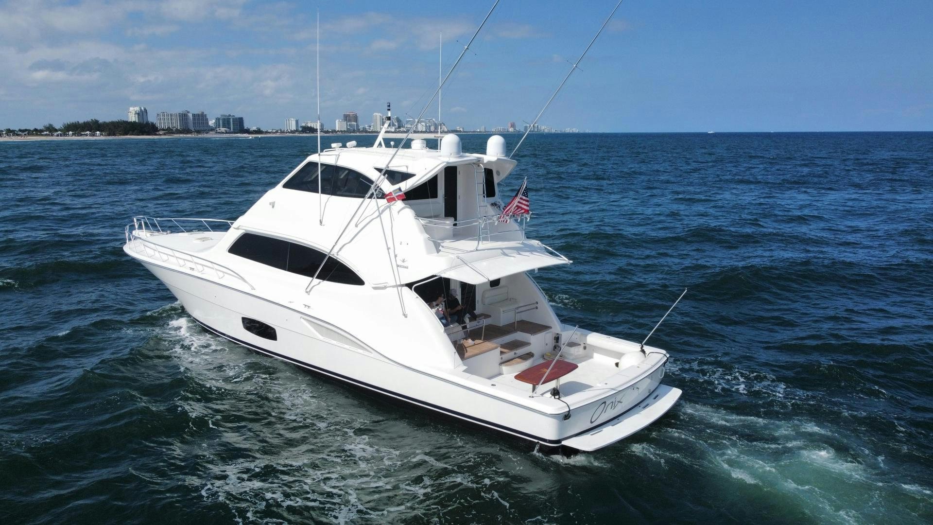 a white yacht in the water aboard ONIX Yacht for Sale