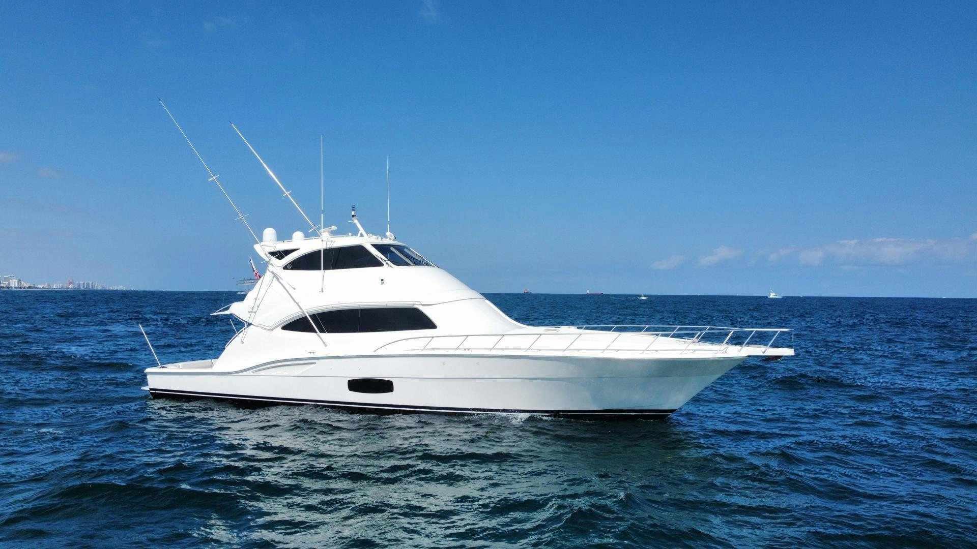 a white yacht in the water aboard ONIX Yacht for Sale
