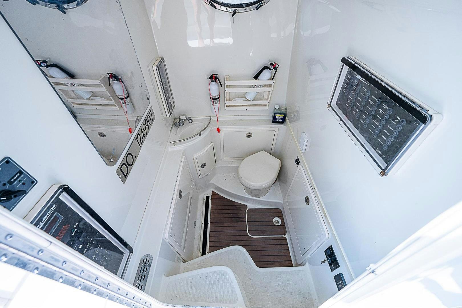 a small bathroom with a sink and toilet aboard S3XY Yacht for Sale