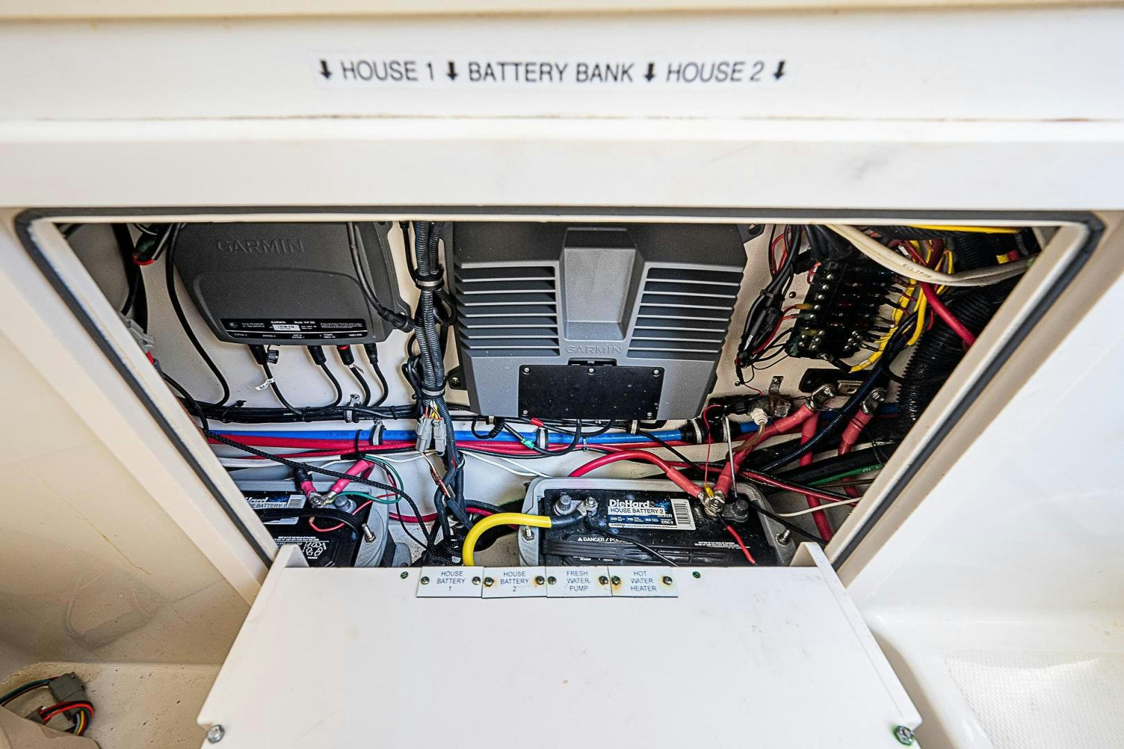 a computer with wires and cables aboard S3XY Yacht for Sale