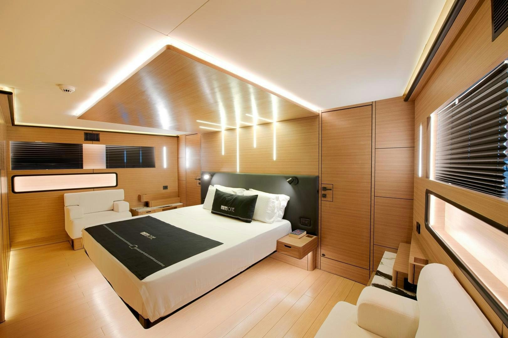 a modern looking room with a large bed and a tv aboard MITI ONE Yacht for Sale