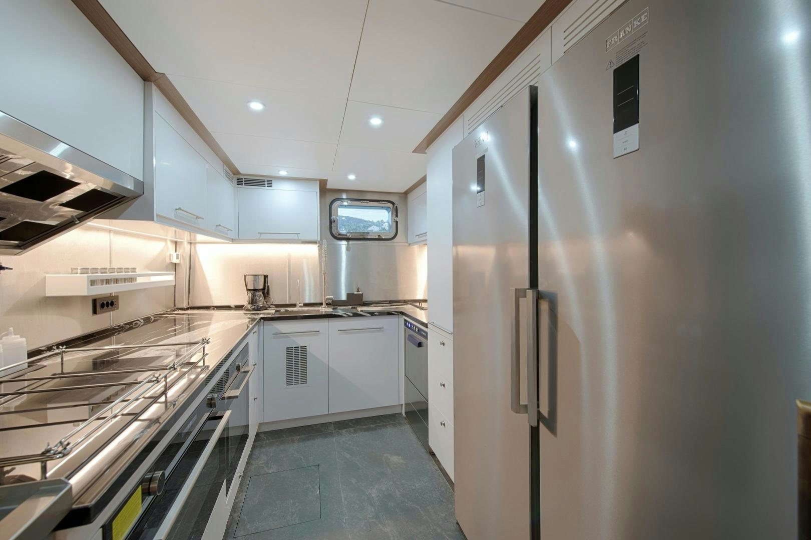 a kitchen with stainless steel appliances aboard MITI ONE Yacht for Sale