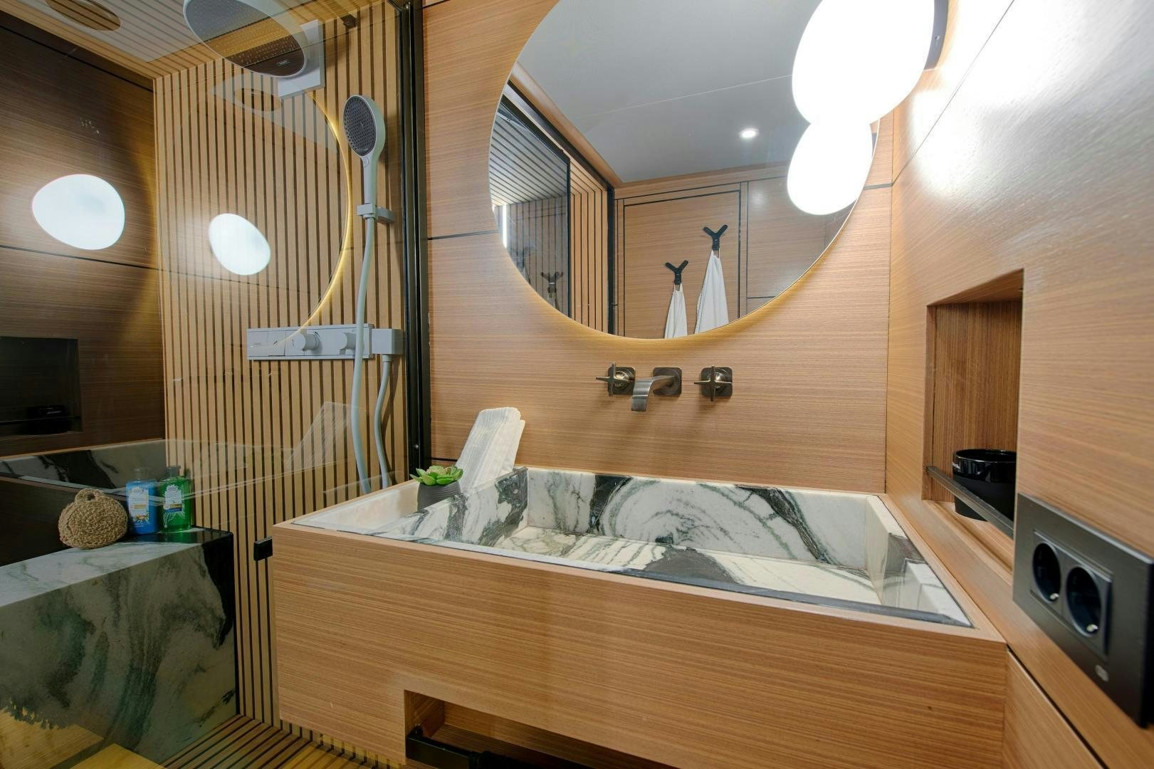 a bathroom with a large mirror aboard MITI ONE Yacht for Sale