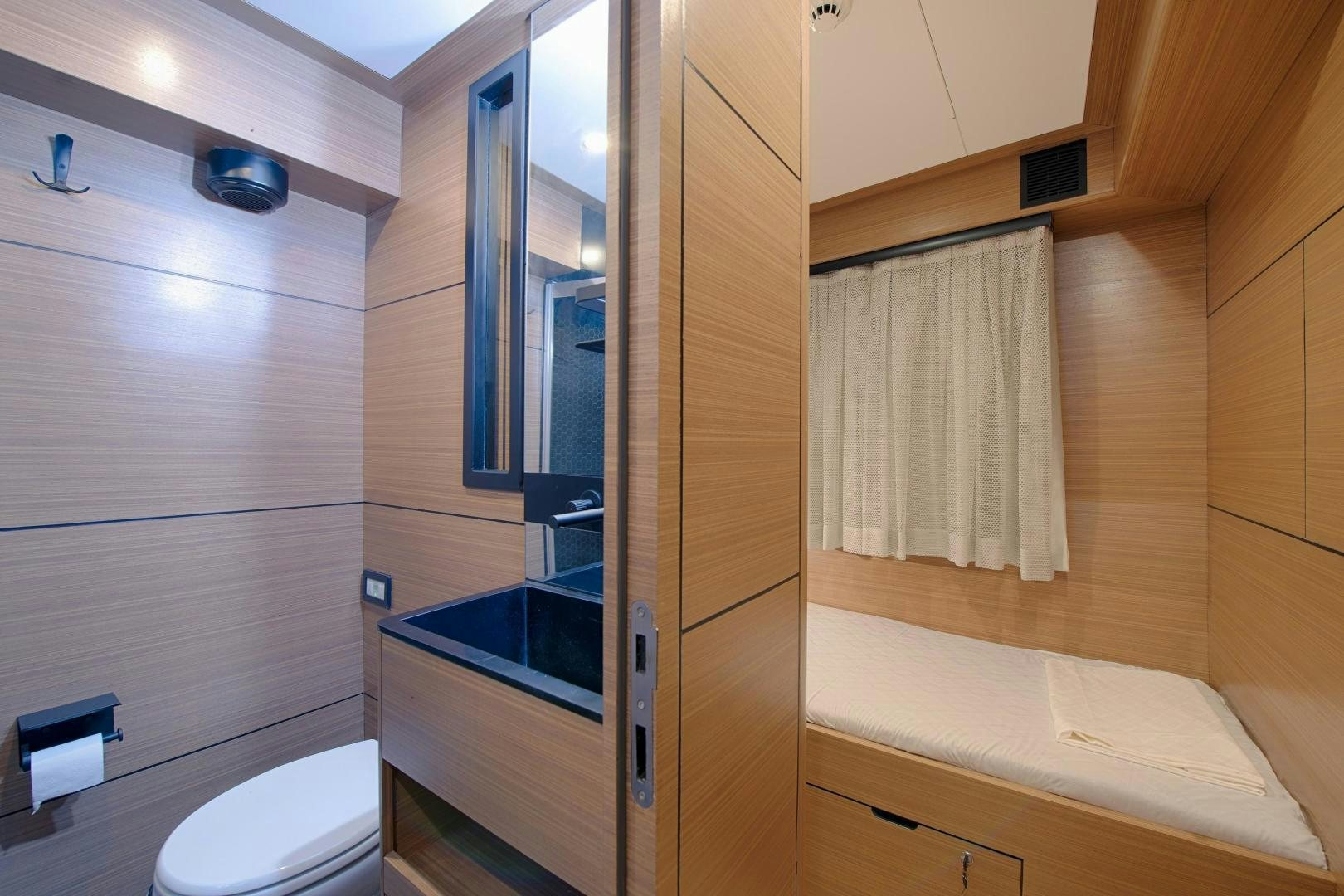 a bathroom with a glass shower aboard MITI ONE Yacht for Sale