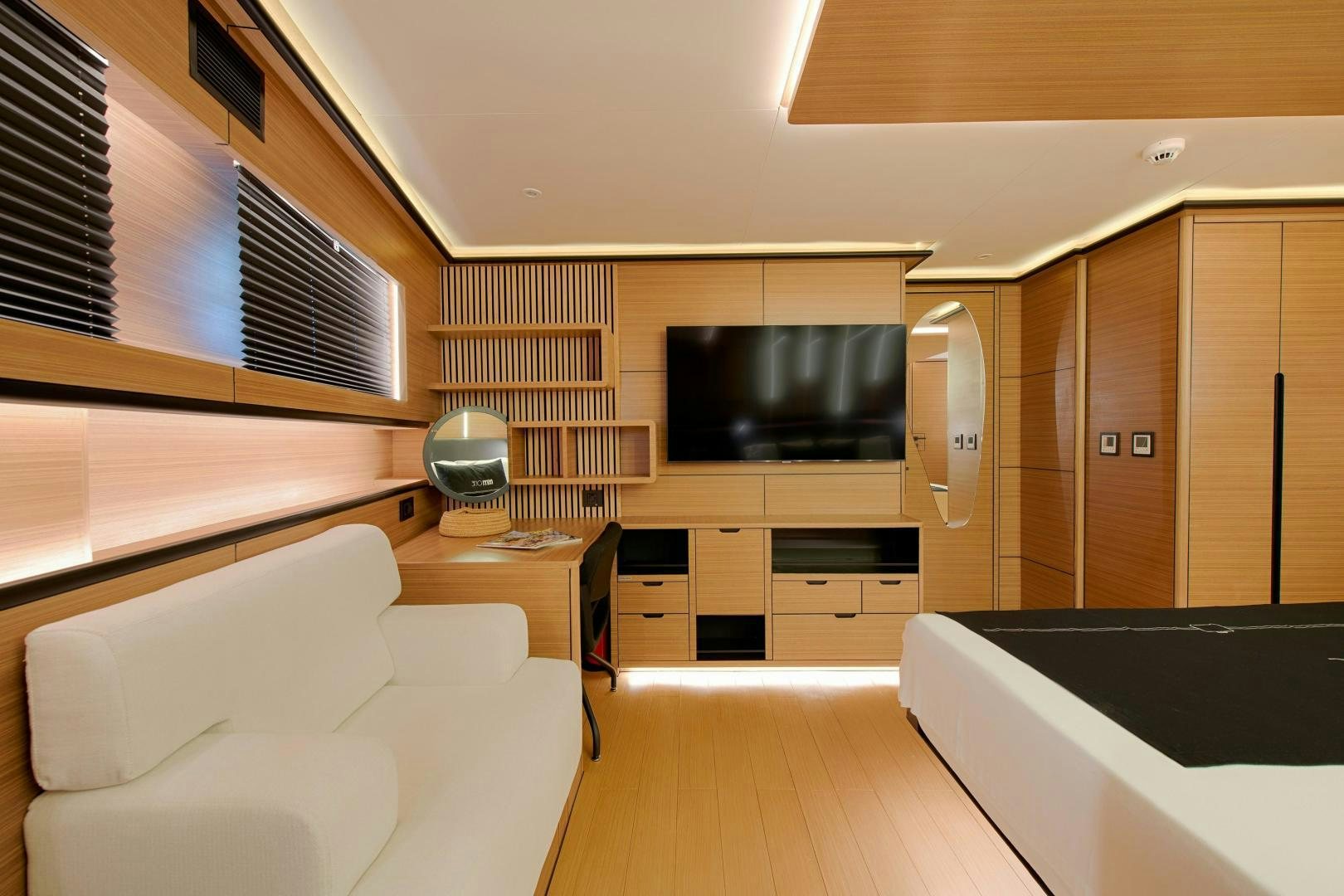 a room with a tv and a couch aboard MITI ONE Yacht for Sale