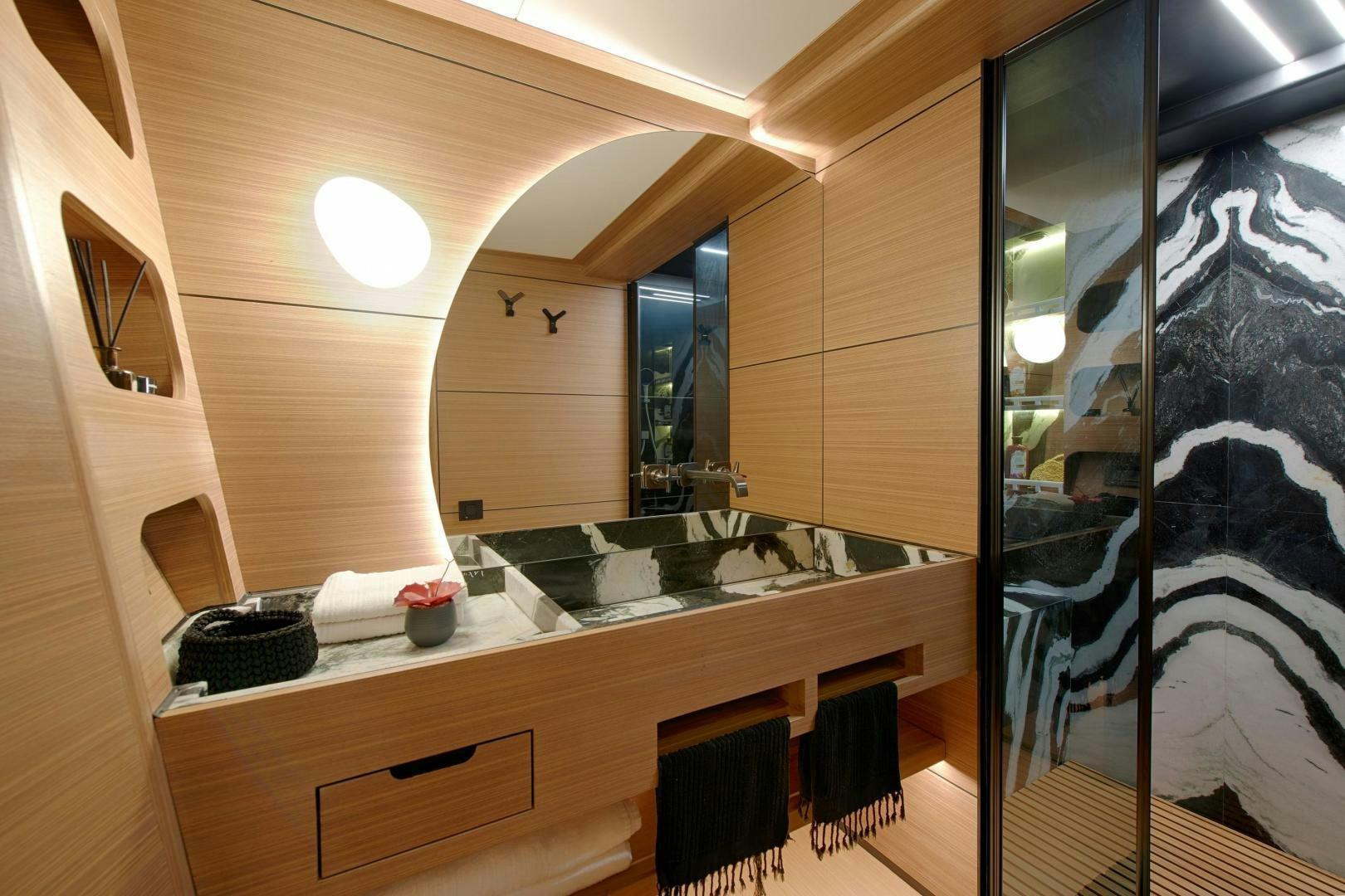 a bathroom with a large glass shower aboard MITI ONE Yacht for Sale