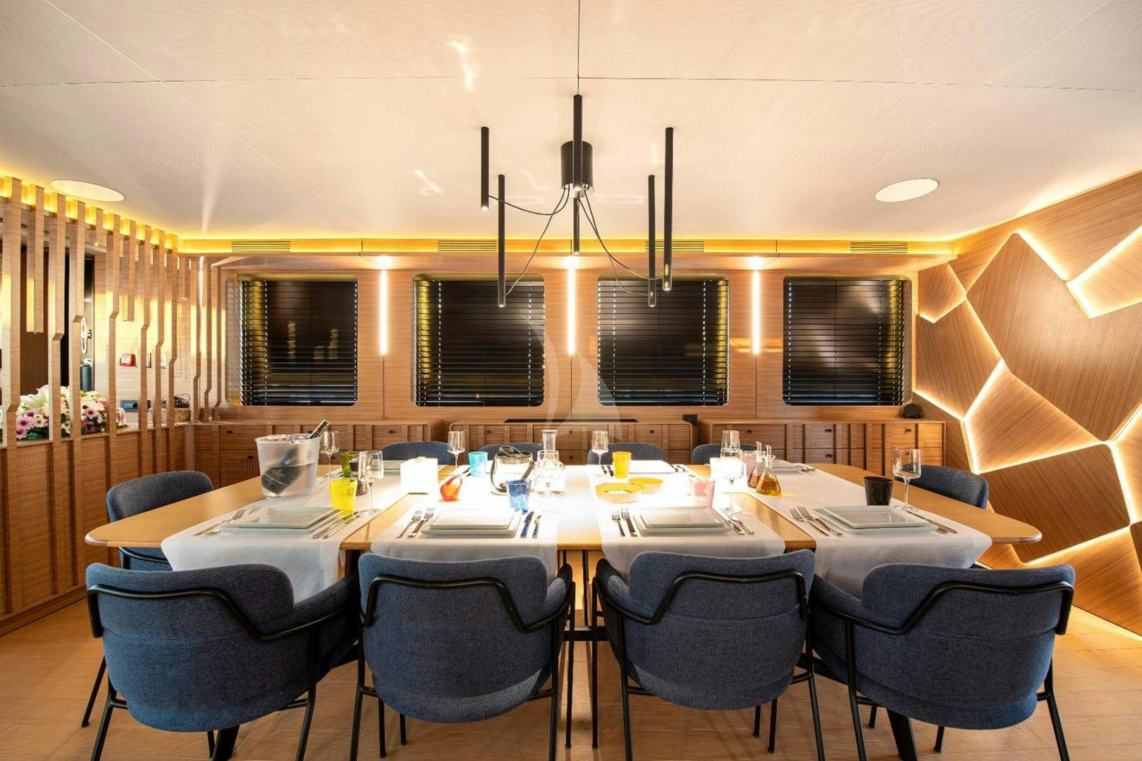 a room with a table and chairs aboard MITI ONE Yacht for Sale