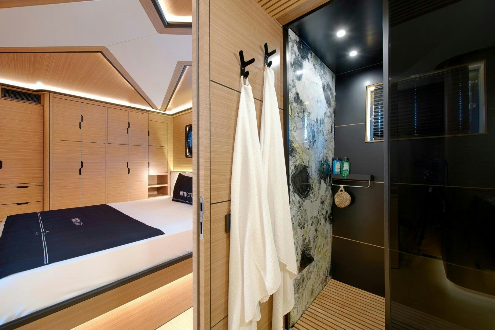 a room with a curtain and a bathtub aboard MITI ONE Yacht for Sale