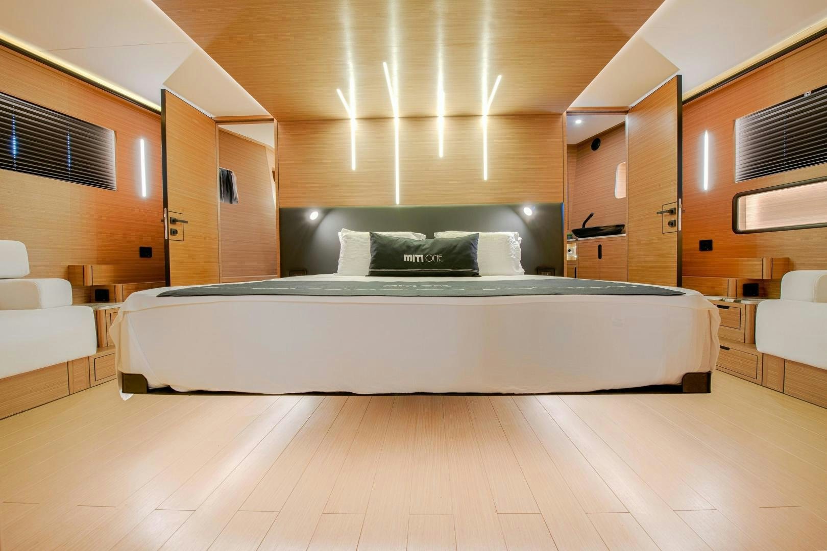a large bed in a room aboard MITI ONE Yacht for Sale