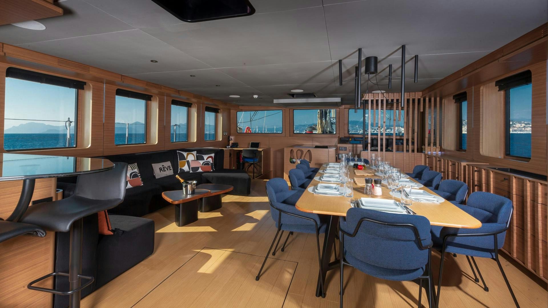 a room with a table and chairs aboard MITI ONE Yacht for Sale