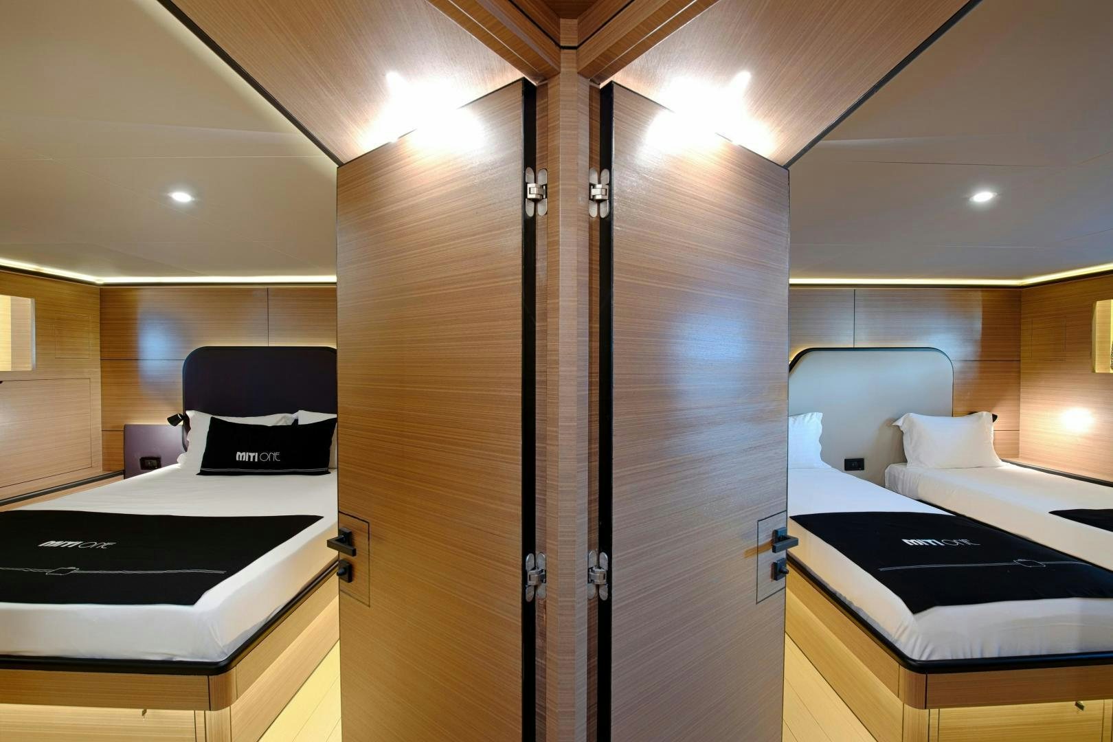 a room with a bed and a desk aboard MITI ONE Yacht for Sale